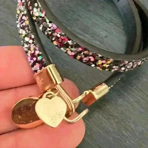 Victoria Emerson Bracelet in Black sparkle leather with charm heart and logo.